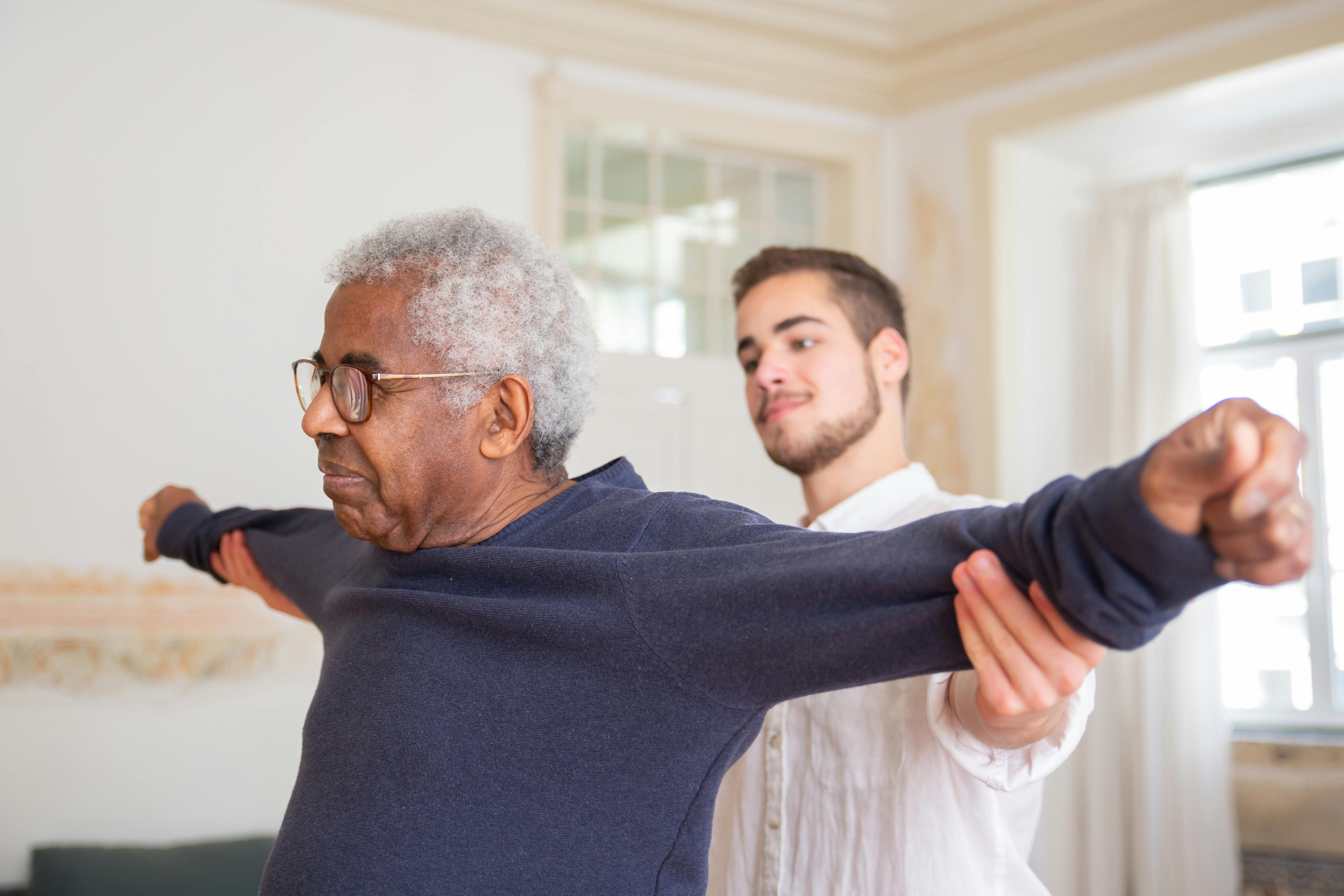 Resident in physical therapy session at Agape - A Waters Community